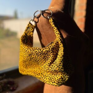 NWOT URBAN OUTFITTERS LEOPARD CALF HAIR HANDBAG.
